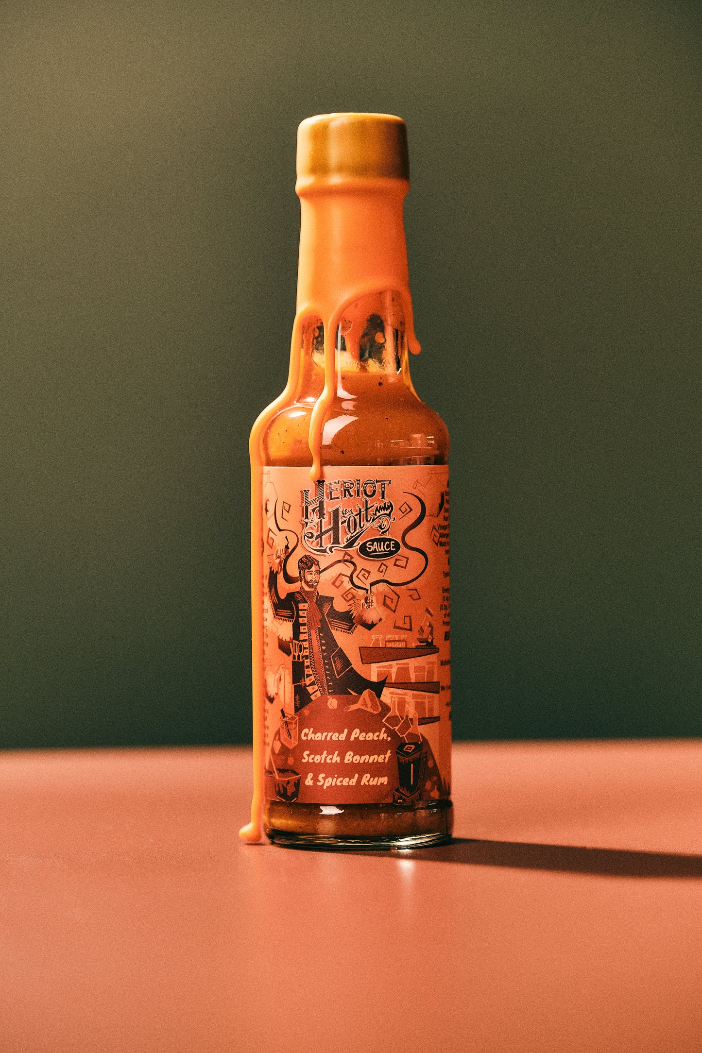 Charred Peach, Scotch Bonnet and Spiced Rum Hott Sauce Colourful Professional Photo- Heriot Hott