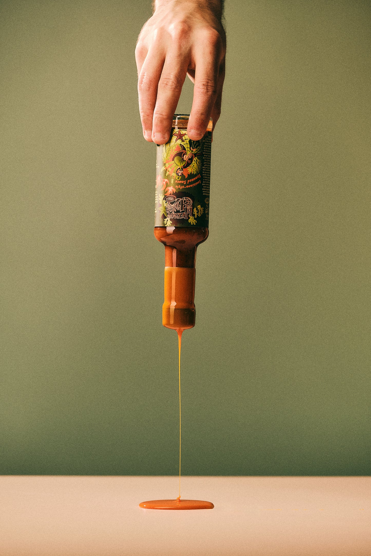 Wax Dripping From Lousiana-Style Seaweed Hott Sauce - Heriot Hott