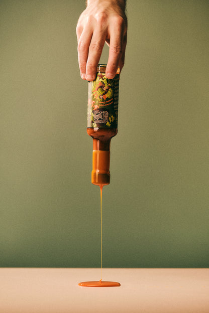 Wax Dripping From Lousiana-Style Seaweed Hott Sauce - Heriot Hott